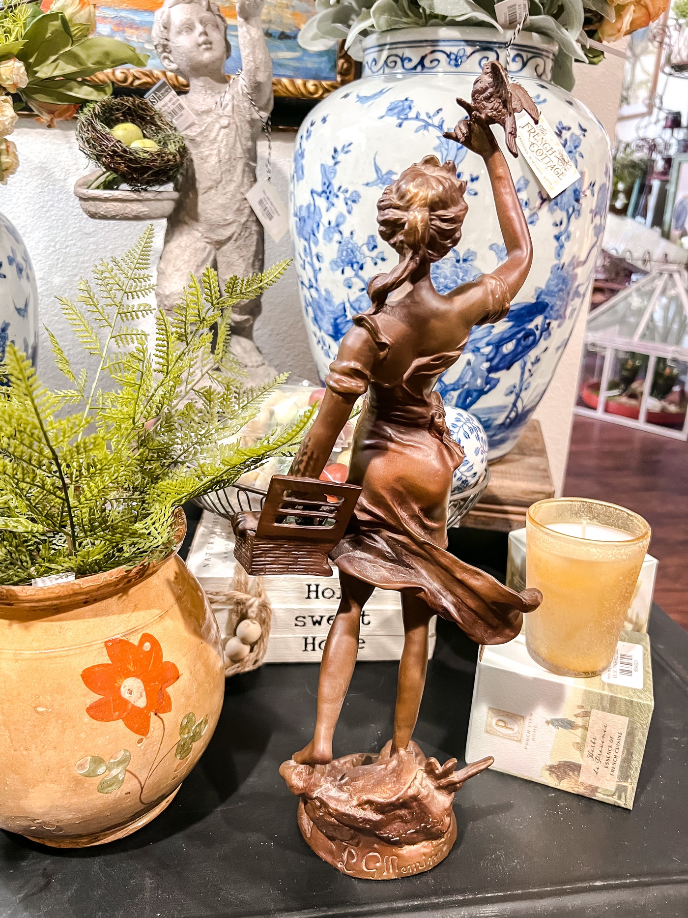 Bronze Sculpture of Woman with Basket and Birds