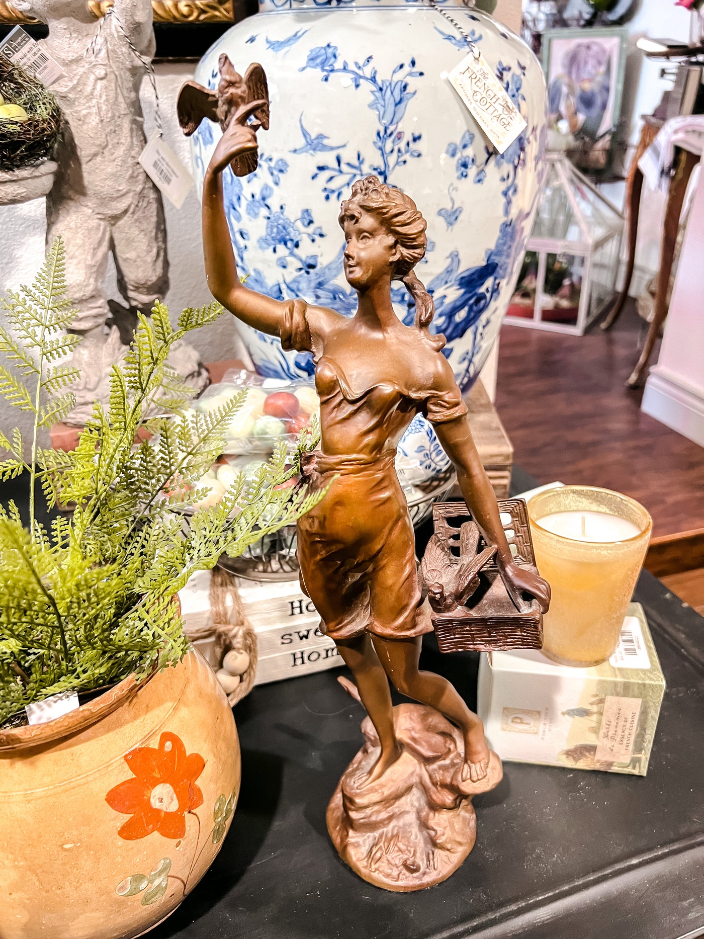 Bronze Sculpture of Woman with Basket and Birds